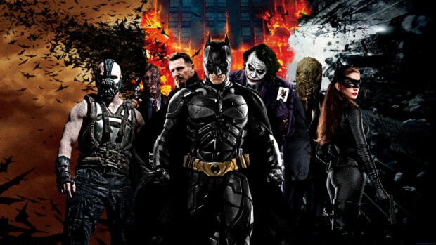 Bane from Batman standing with villains and heroes in front of a burning cityscape