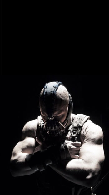 Muscular Bane character from Batman wearing mask and tactical gear in dark setting