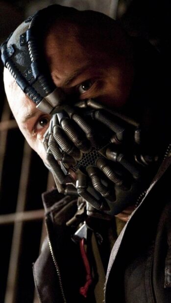 A close up of Bane wearing his iconic mask with intense eyes visible