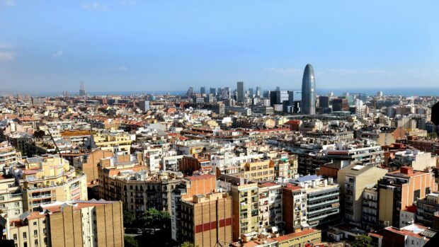 Barcelona cityscape featuring the iconic Torre Glories under a clear sky with Spain Wallpapers, 4K Desktop Wallpaper