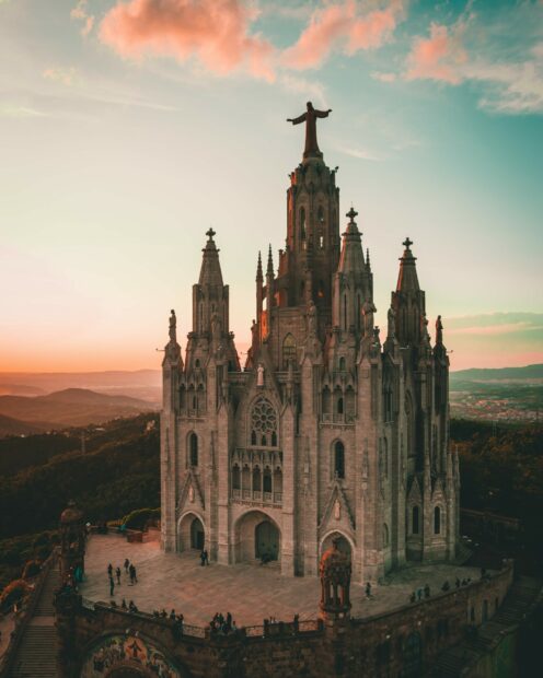 A majestic temple in Spain with a statue overlooking the mountains, 2K Mobile Wallpaper