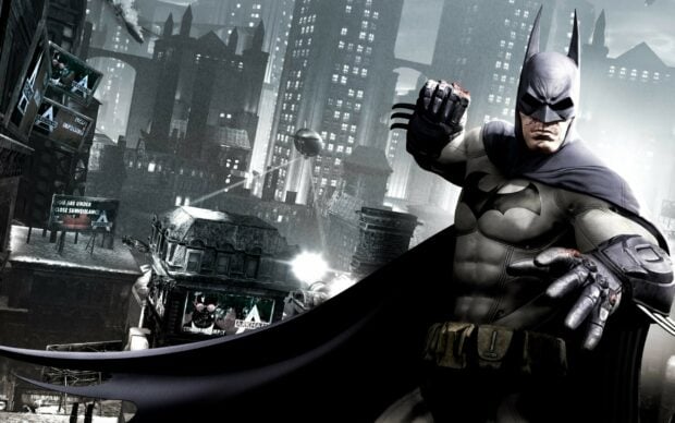 Batman Arkham City character standing ready to fight in a rainy dark urban environment
