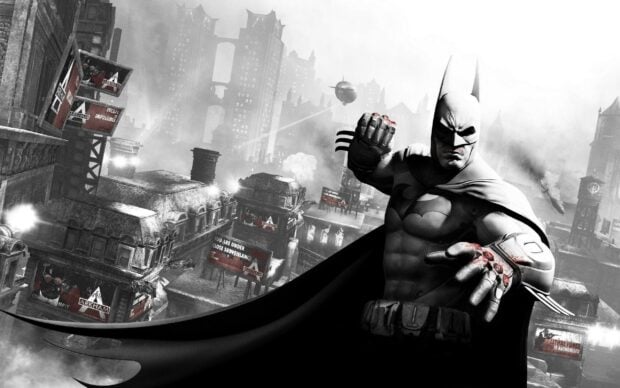 Batman Arkham City standing with bloodied fists in a dark Gotham cityscape