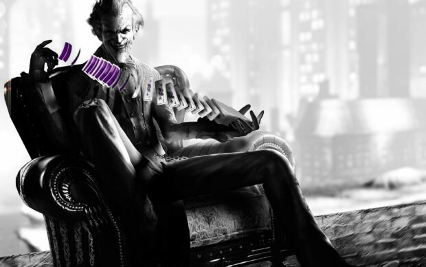 The Joker from Batman Arkham City sits on a chair playing cards with a sinister smile