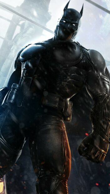 Batman wearing a tactical suit in Batman Arkham City with a determined look