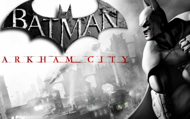 Batman Arkham City features a dark cityscape with Batman crouching ready for action