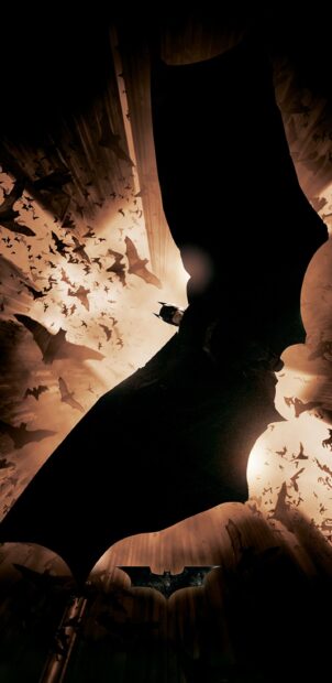 Batman gliding through a swarm of bats in a dark and dramatic scene