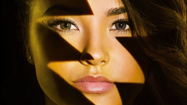 Close up of Becky G face with a star shaped shadow on her skin
