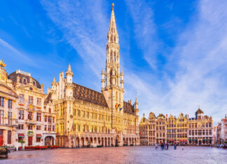 The Grand Place square with historic buildings in Belgium under a clear blue sky