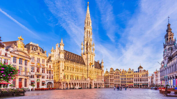 The Grand Place square with historic buildings in Belgium under a clear blue sky