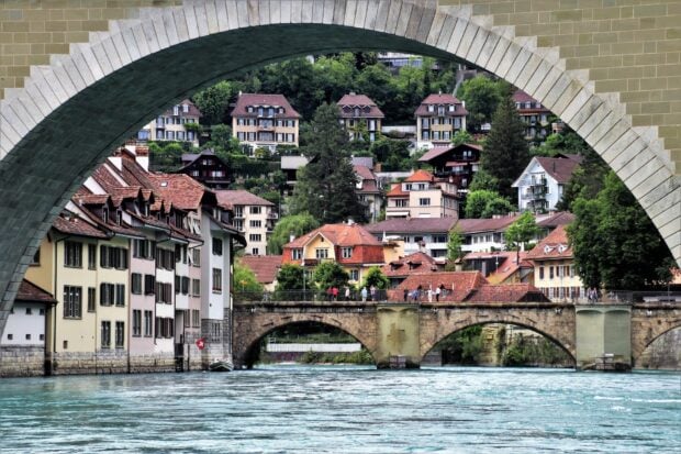 Bern Switzerland Wallpaper HD Desktop a scenic view of historic buildings and bridges over a river in Bern Switzerland