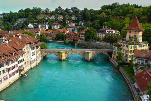 Bern Switzerland wallpapers showing historic buildings by the turquoise river and scenic bridge