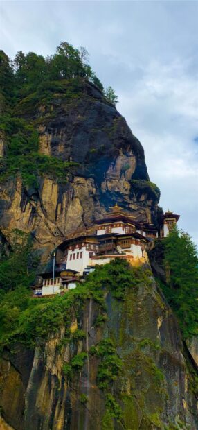 Tiger Nest monastery perched on rocky cliffs in Bhutan landscape