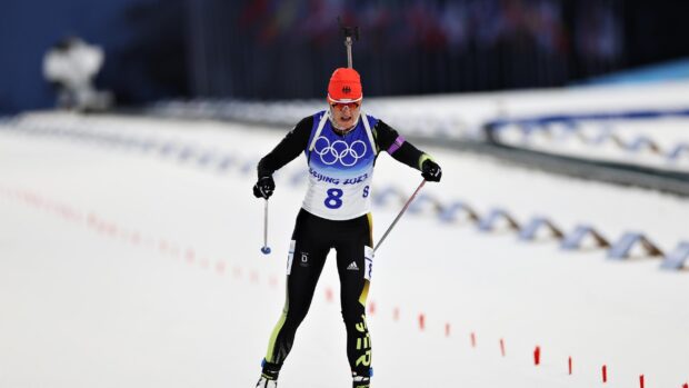 Biathlon athlete competing in a skiing race during the winter sports event