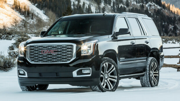 The GMC Wallpapers shows a black truck parked on snow near mountains, HD Desktop Wallpaper