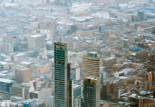 Aerial view of Bogota with skyscrapers and dense urban area, HD Mobile Wallpaper