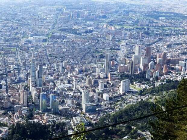 Aerial view of Bogota with skyscrapers and green areas, HD Desktop Wallpaper