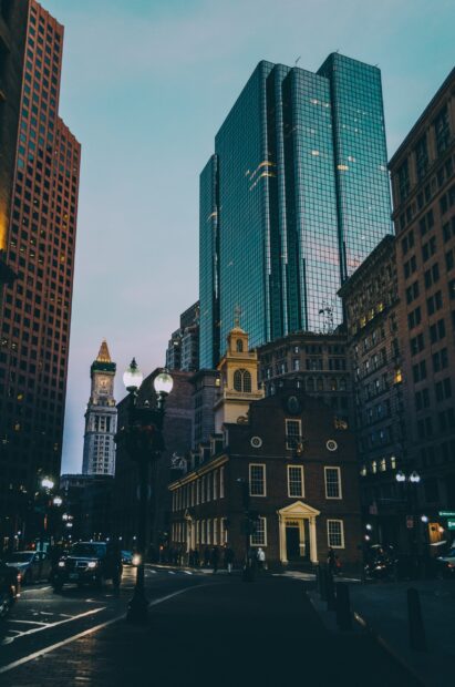 Historic Boston street with old and modern buildings during twilight in Boston