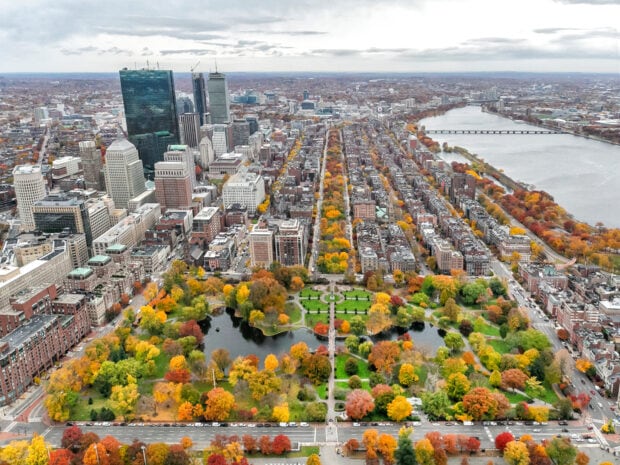 Autumn view of Boston cityscape with park and river in fall season