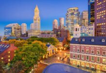 Historic Boston skyline with modern buildings and vibrant city lights at dusk