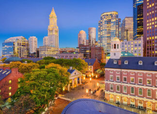 Historic Boston skyline with modern buildings and vibrant city lights at dusk