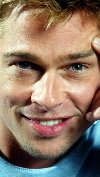 Close up of Brad Pitt smiling with blue eyes and blonde hair