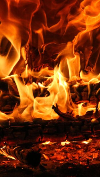 The bright flames are burning intensely on the logs in the fireplace, HD Phone Wallpaper