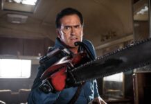 Bruce Campbell is holding a chainsaw with determination inside a dimly lit room, 4K Desktop Wallpaper