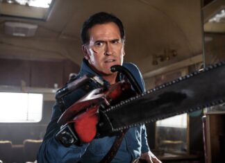 Bruce Campbell is holding a chainsaw with determination inside a dimly lit room, 4K Desktop Wallpaper