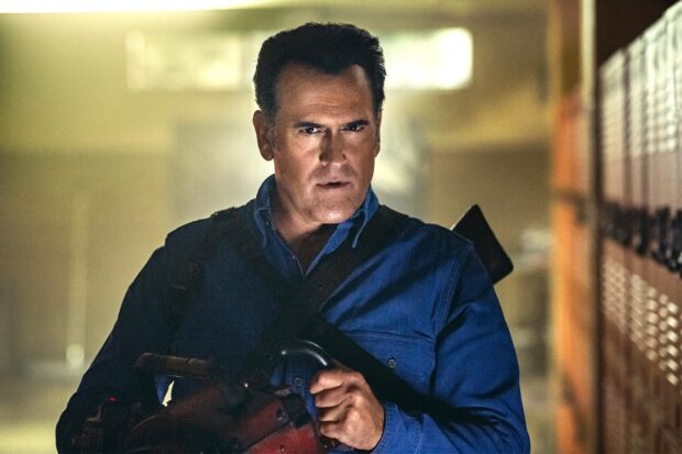 Bruce Campbell holding a chainsaw in a tense scene, HD Desktop Wallpaper