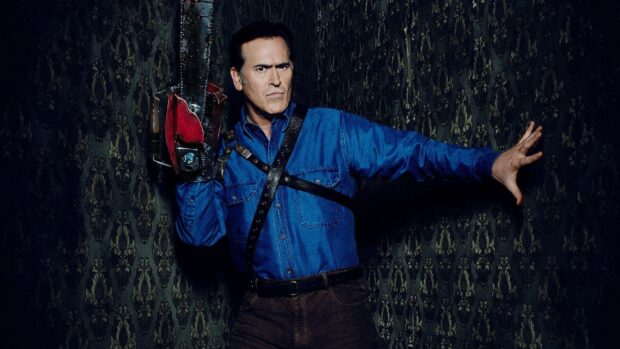 Bruce Campbell wallpapers shows him holding a chainsaw while posing against a dark patterned wall, HD Desktop Wallpaper
