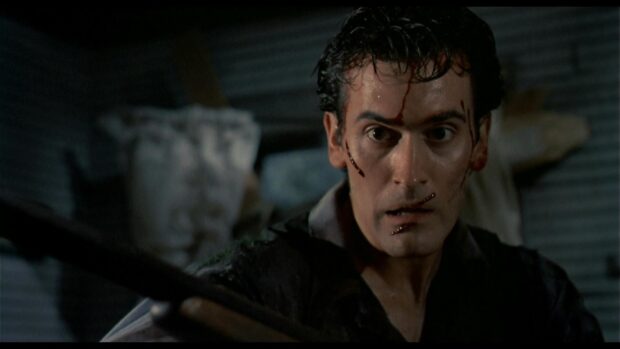 Bruce Campbell is focused and injured during an intense moment in the scene, HD Desktop Wallpaper
