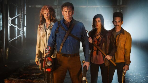 Bruce Campbell Wallpapers show a group ready for action in a dimly lit industrial environment, HD Desktop Wallpaper