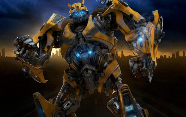 Detailed Bumblebee Transformers robot standing on a road with city skyline at sunset