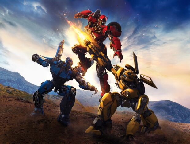 Bumblebee and other robots from Transformers battling in a rocky outdoor scene