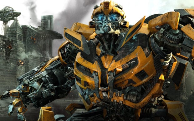 Bumblebee robot stands ready with detailed mechanical parts in a city battle scene background