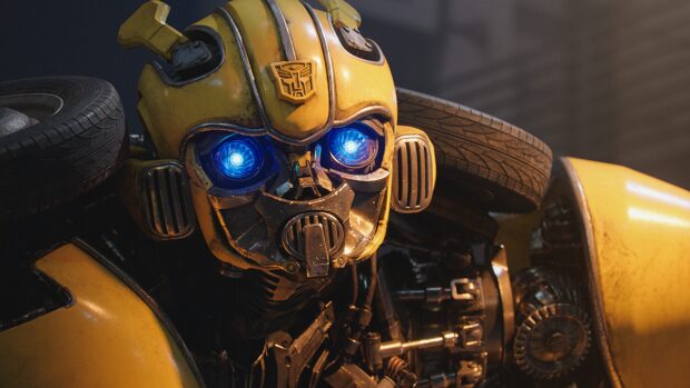 A close up of Bumblebee robot with glowing blue eyes and yellow armor in high detail