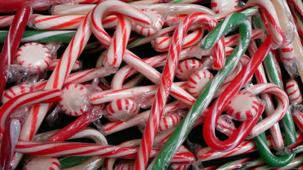 Red and green striped candy cane mix piled together in close up view