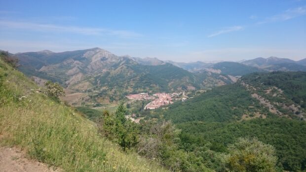 A scenic view of Cantabrian Mountains with a small town nestled in the valley