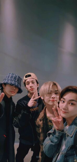 The members of Enhypen are posing casually making peace signs in this image, HD Mobile Wallpaper