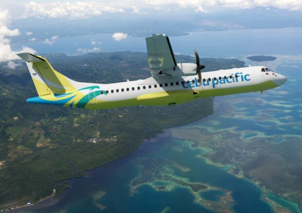 A Cebu Pacific Air aircraft is flying over tropical islands and clear blue waters, HD Desktop Wallpaper