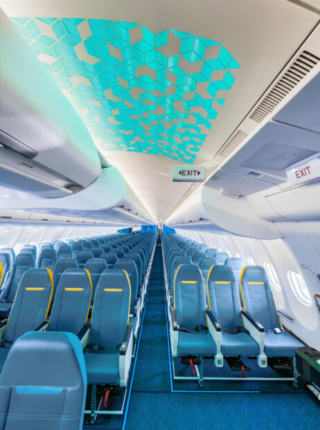 The Cebu Pacific Air cabin features blue seats and a geometric ceiling pattern, HD Mobile Wallpaper