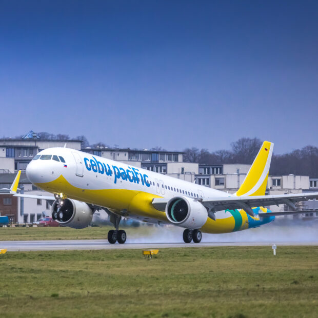 A Cebu Pacific Air plane is taking off from the runway on a cloudy day, HD Desktop Wallpaper