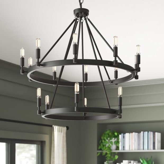 Modern chandelier with multiple exposed bulbs hanging in a cozy room interior