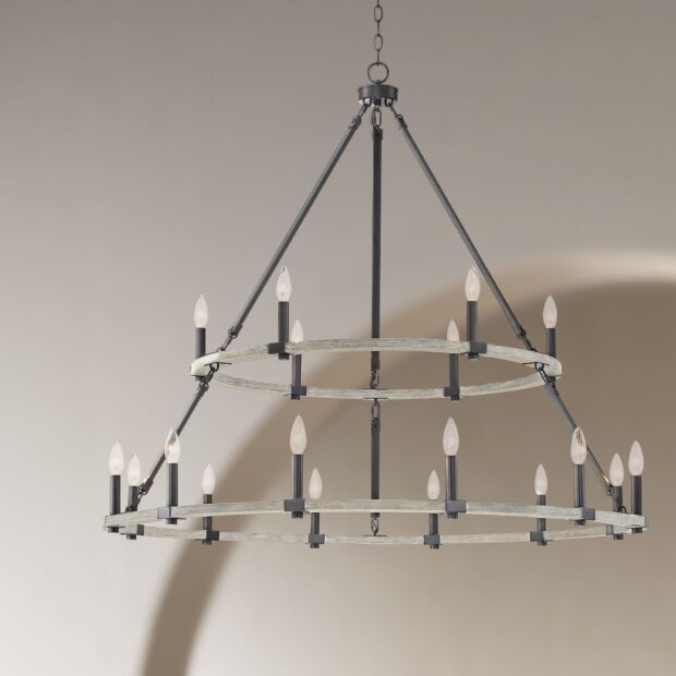 A modern chandelier with multiple candle shaped lights hanging from a metal frame