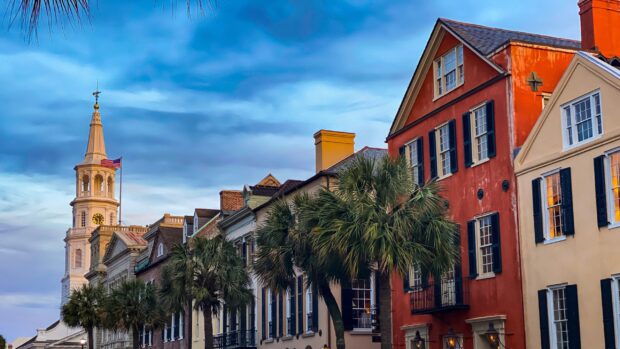 Historic Charleston South Carolina charming street with colorful buildings and palm trees