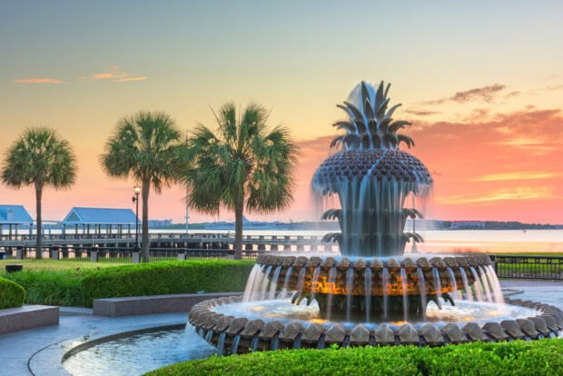 Pineapple fountain with palm trees at sunset in Charleston South Carolina