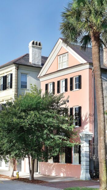 Historic Charleston South Carolina street with pastel houses and green trees