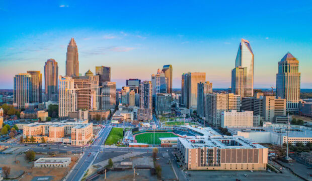 The Charlotte North Carolina skyline features modern skyscrapers and a baseball stadium, HD Desktop Wallpaper