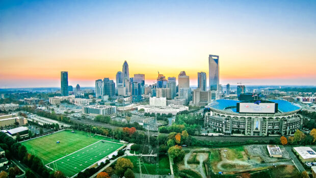 The Charlotte North Carolina skyline glows under a clear evening sky, HD Desktop Wallpaper